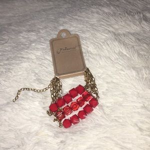 Bran Knew red bracelet